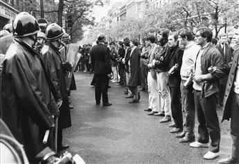 (PARIS, FRANCE--MAY 1968) Group of 15 dynamic photographs depicting the student riots throughout Paris in May 1968.